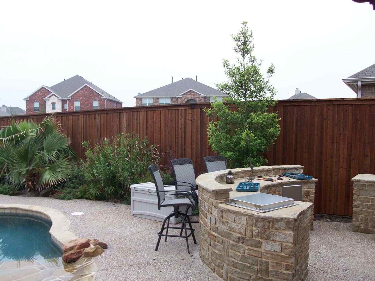 Photo of a stained wood privacy fence in North Dallas Fort Worth area.